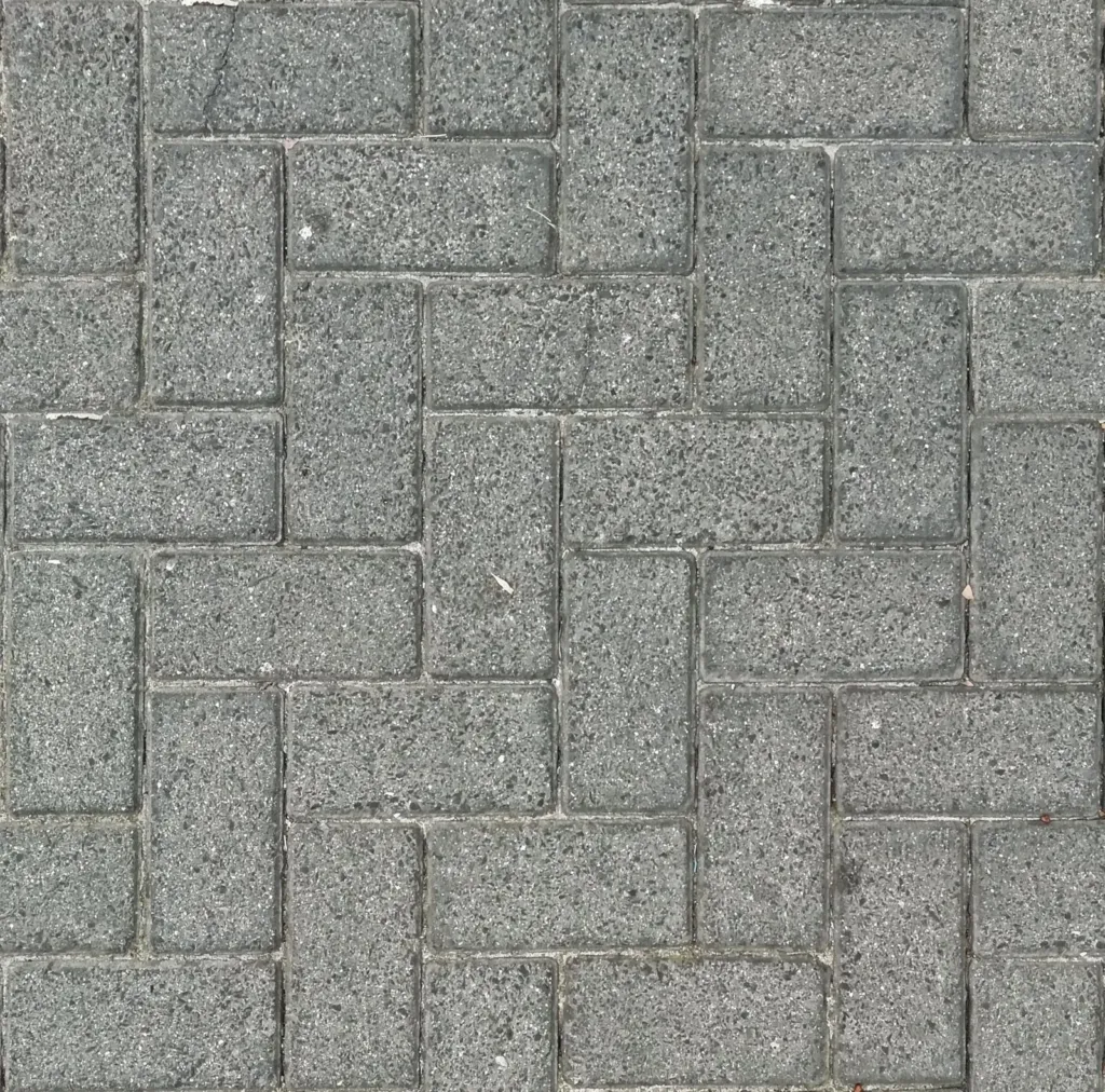 Grijze straatstenen in visgraatverband van bovenaf (placeholder)